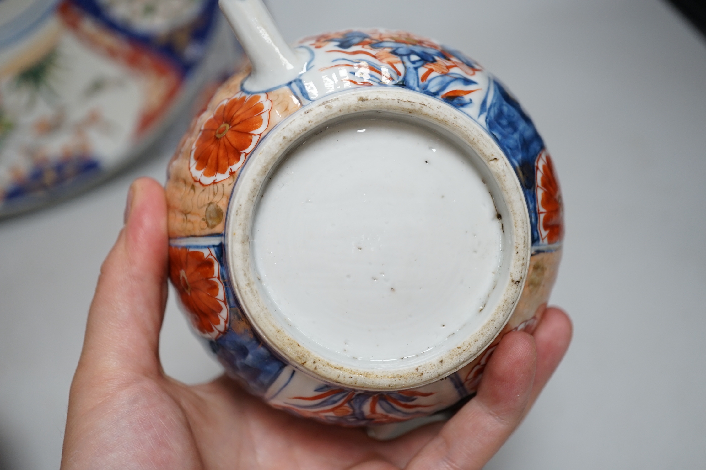 Nine Japanese Imari pieces including; a charger, lidded pot, a bowl, four small gourd vases, two lidded vases and a teapot (a.f.), charger 31cm diameter